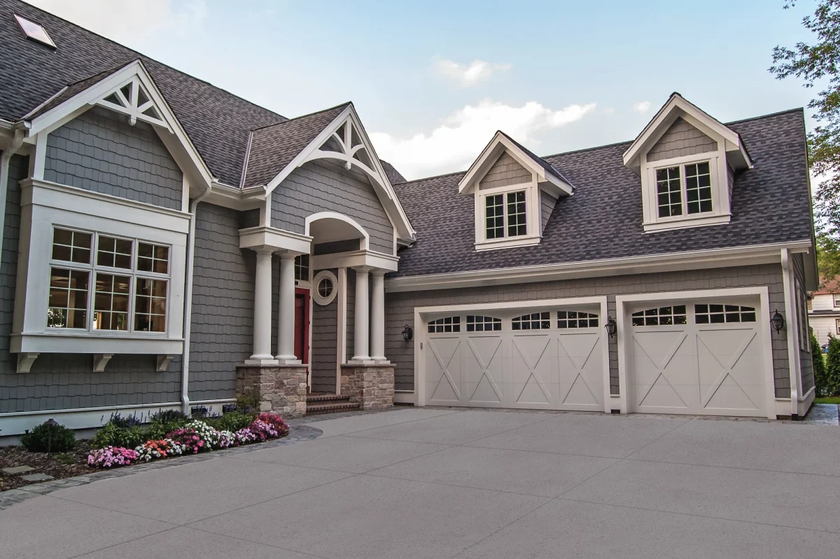 three car garage with two white, barn style garage doors for a Mid-Ohio home